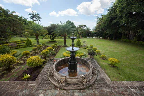 Fountain garden and palm trees Mauritius Island.