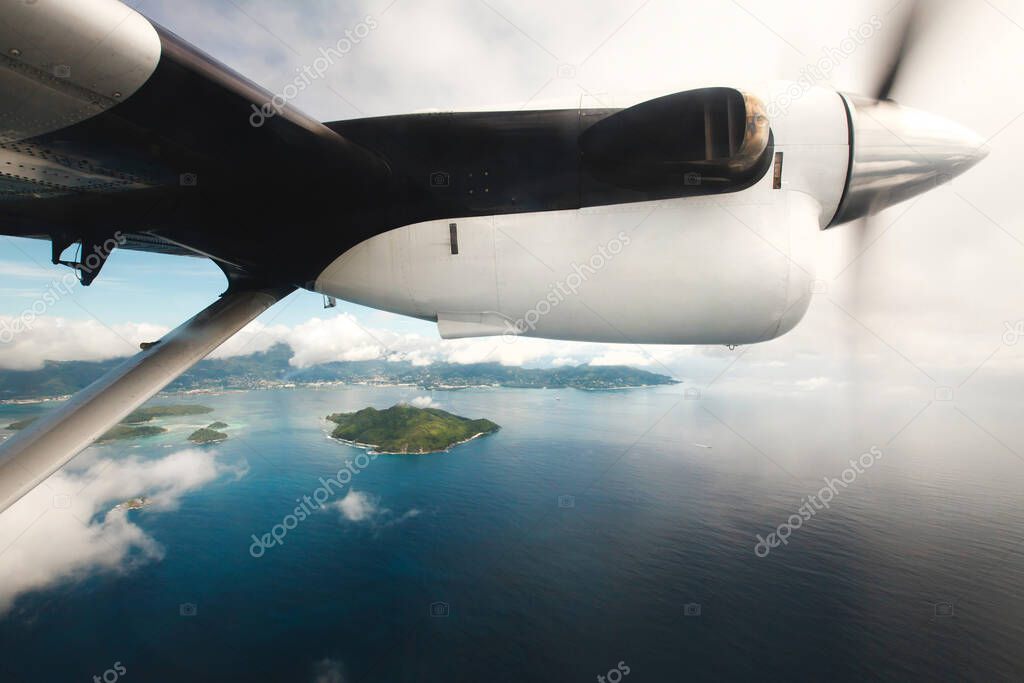 Passenger airliner flies over the Indian ocean. Seychelles.