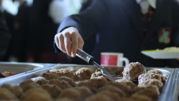 Boy Takes  Meat Cutlet from Big Pan — Stock Video