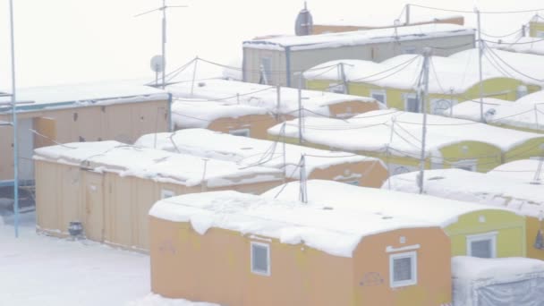 Snowy Town Yellow Prefabricated Lodges Construction Workers Watchmen Amidst Trees — 비디오