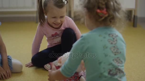 Girls playing with lamb in kindergarten — Stock Video