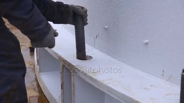Worker putting pin into structure — Stock Video
