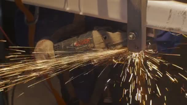 Worker grinding metal detail part — Stock Video