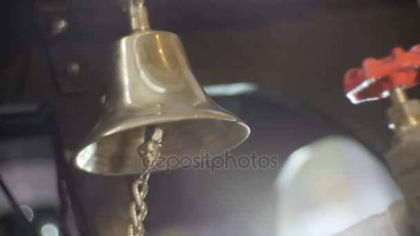 Yellow copper bell ringing loudly — Stock Video