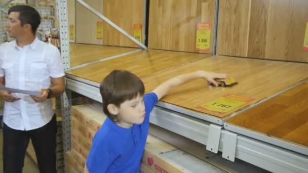 Boy playing with toy car — Stock Video