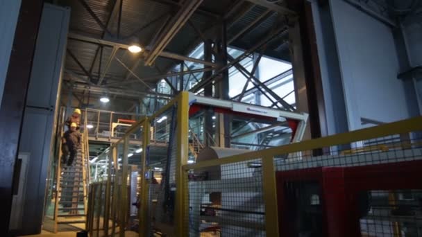 Workers going down on metal stairs — Stock Footage Workers going down on metal stairs Video Clip