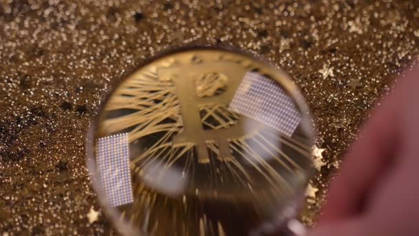 Macro View Magnifier Wonderful Famous Bitcoin Real Model Laying Gold — Stock Video