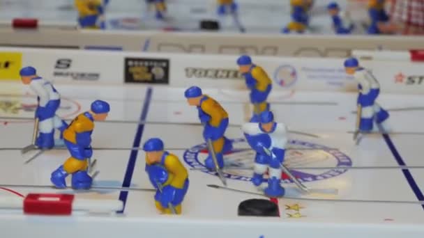 Table hockey game with bright figures on arena closeup — Stock Video