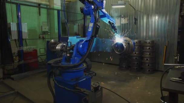 Machine welds large metal pipe in production plant shop — 비디오