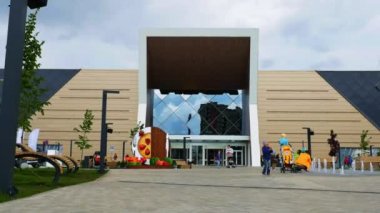 alışveriş merkezinin yanındaki çeşmeli şehir bahçesi boyunca hareket