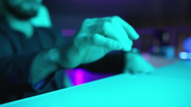 person touches invisible virtual screen at white table