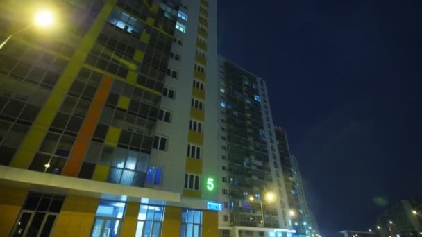 Complex with multi-storey buildings at cold winter night — Stock video