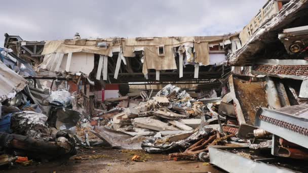 Destroyed hockey stadium with garbage at demolition works — Stock Video