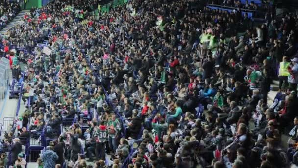 People clap hands supporting favorite hockey team in stadium — Stock Video