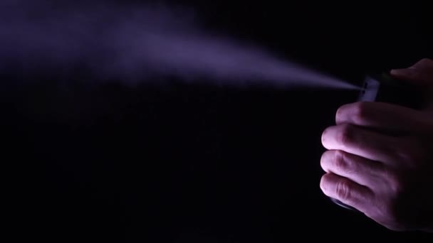 Hand with bottle of pepper spray.  Tear gas — Stock Video
