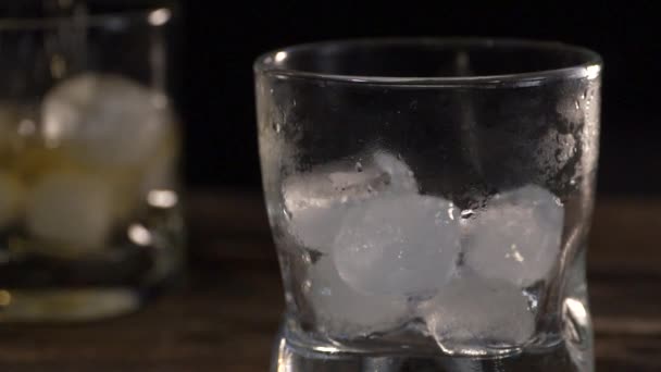 Golden Malt Whiske Poured Glass Glass Ice Cubes — Stock Video