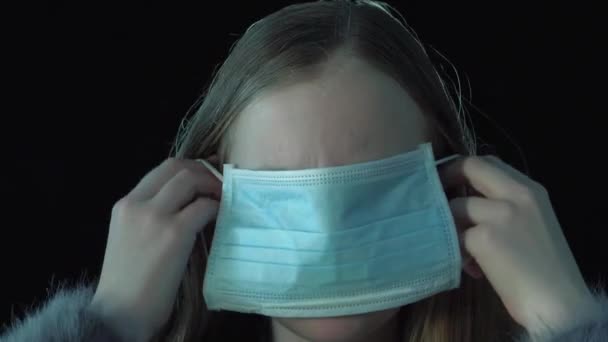 Cute Sick Girl Putting Medical Mask — Stock Video