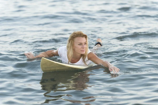 Beautiful woman with the surfboard