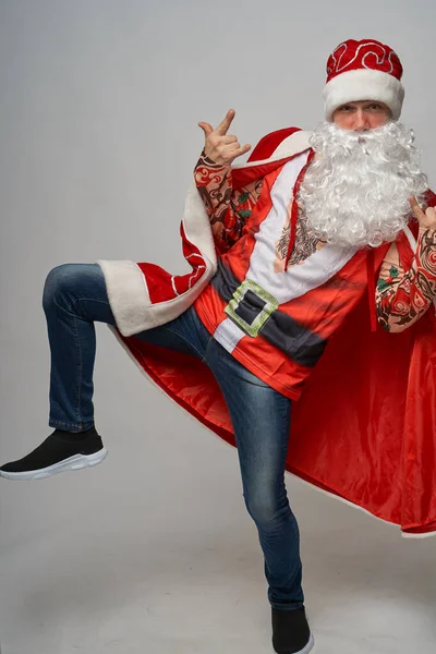 amazing man in a Santa Claus hat danced crazy dances.