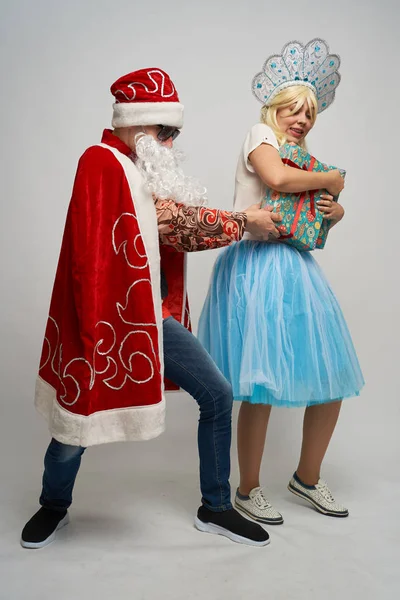 Santa Claus and snow maiden, thanksgiving, Christmas and New year, red yellow blue balls, — Stock Photo, Image