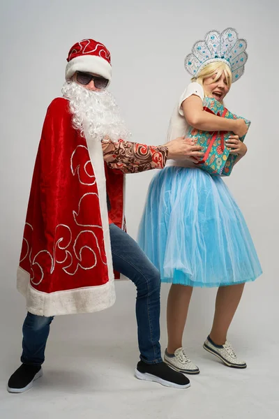 Santa Claus and snow maiden, thanksgiving, Christmas and New year, red yellow blue balls, — Stock Photo, Image