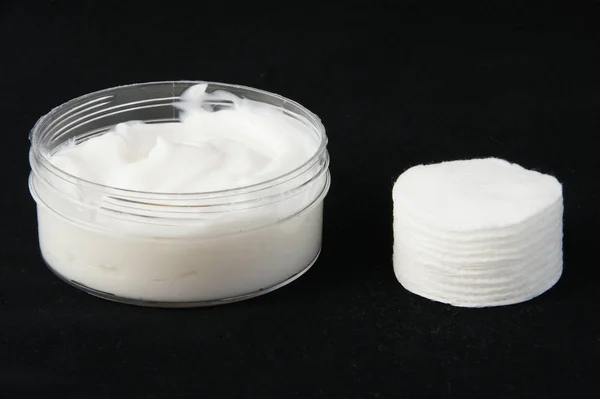 A jar of cream and pads — Stock Photo, Image