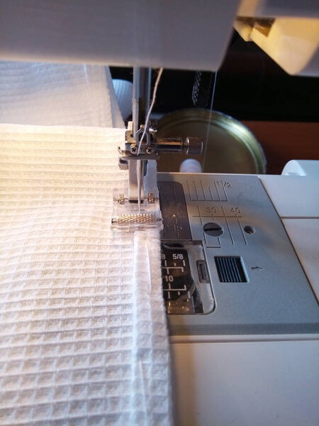 the process of sewing on the machine