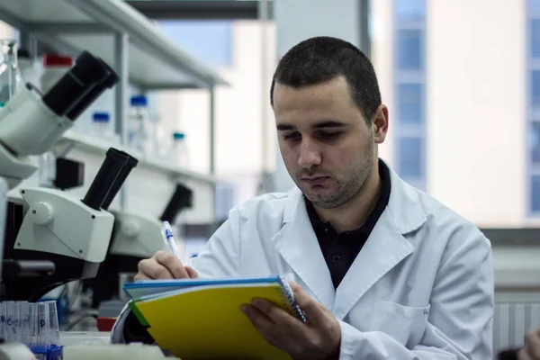 Modern scientist working with pipette in biotechnology laborator — Stock Photo, Image