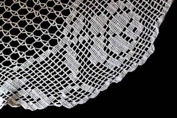 Handmade, white crochet, embroidery, on a black background, cont