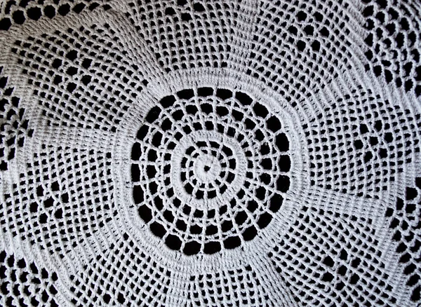 Handmade, white crochet, embroidery, on a black background, cont