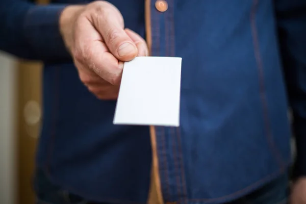 Bank card, business card, businessman holds card in hand, financ