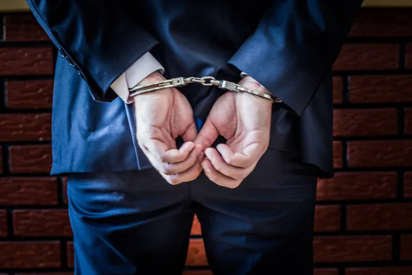 Businessman and his hands on the back handcuffed because of crim — Stock Photo, Image