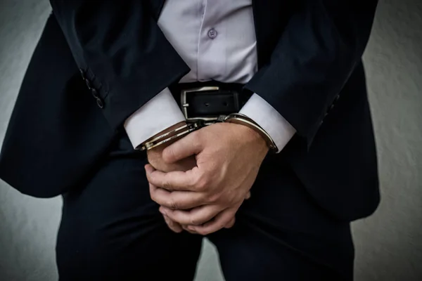 A businessman caught with handcuffs on his stomach for corruptio