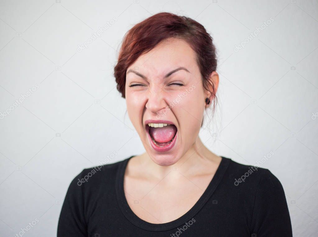 Young girl, screaming, white background, studio, facial expressi