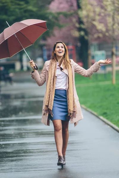 Girl walking on wet street