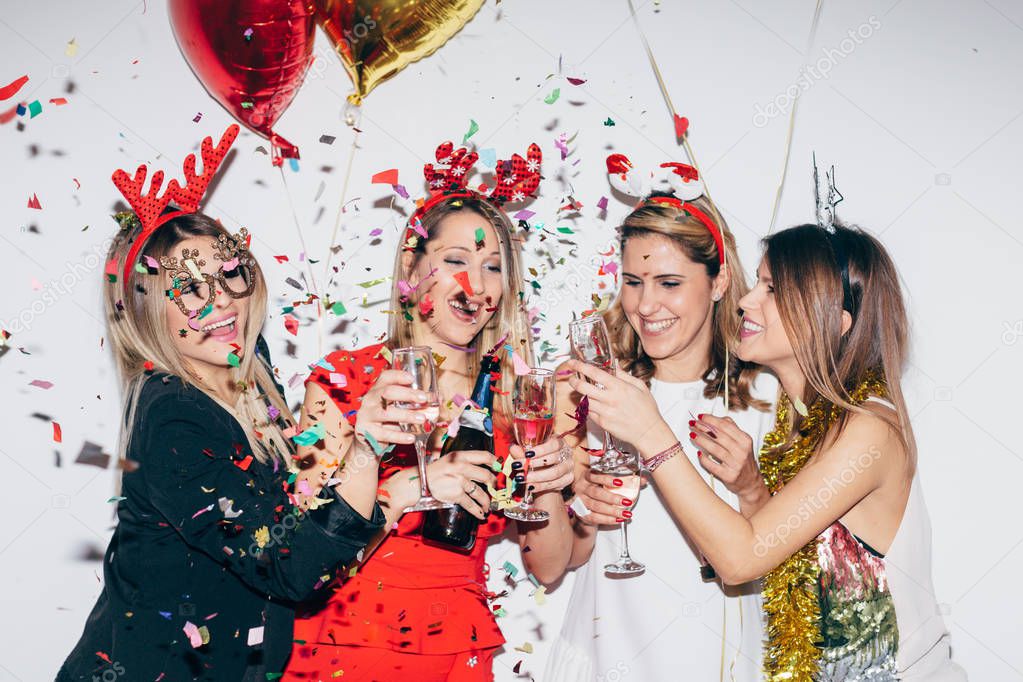 Girls in festive costumes celebrating christmas