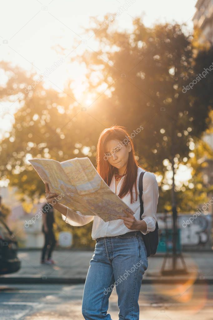 Woman traveler using map 