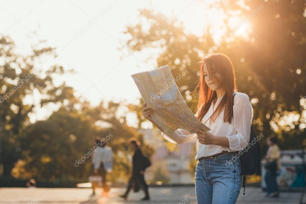 Woman traveler using map 
