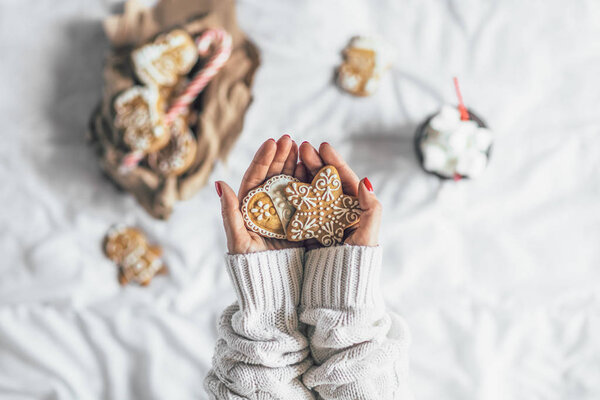 Young Woman Holding Christmas Cookies Top View — Stock Photo, Image