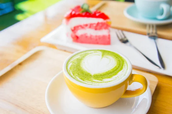 Hot green tea milk cup and coffee cup and strawberry cake — Stock Photo, Image