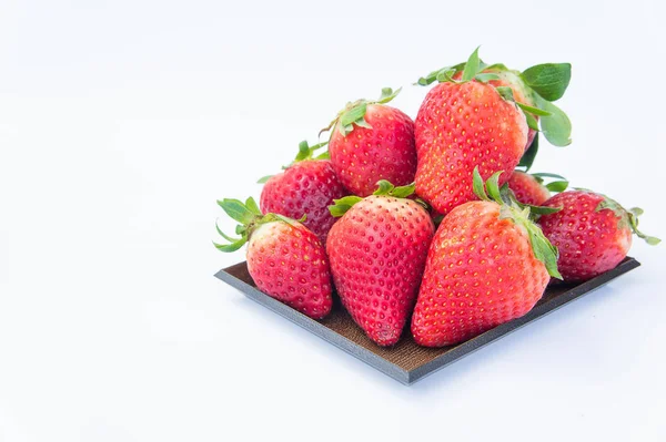 Strawberry on white background fruit 's healthful cordial, useful — стоковое фото