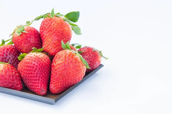 Strawberry on white background fruit 's healthful cordial, useful — стоковое фото