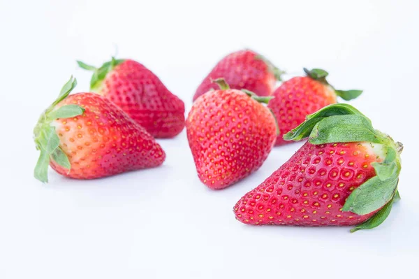 Strawberry on white background fruit 's healthful cordial, useful — стоковое фото