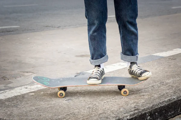 skateboarder skateboarding at city on street
