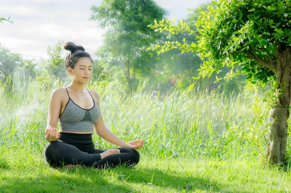 woman practicing  yoga day relax in nature