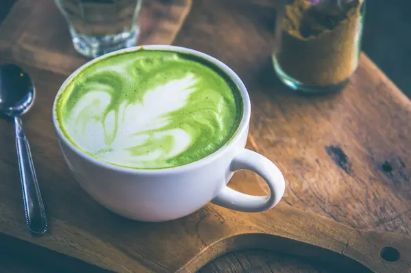 Green tea hot drink latte white cup on wood table aroma relax ti — Stock Photo, Image