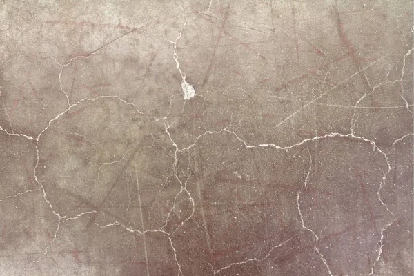 Textuur van rode gebarsten beton — Stockfoto