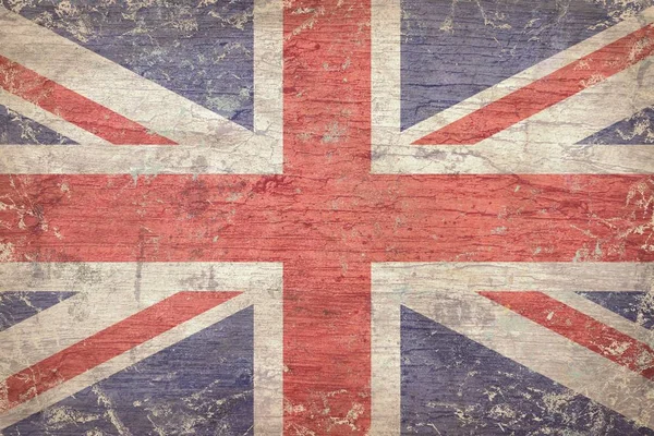 Рисунок флага Соединенного Королевства на поверхности треснувшей древесины — стоковое фото