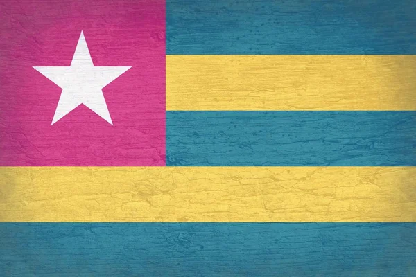 Grunge Togo vlajky pozadí na prasklý povrch dřeva — Stock fotografie