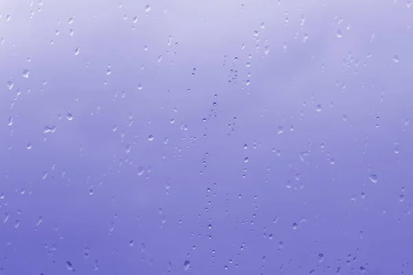 Blue abstract raindrops on the window — Stock Photo, Image